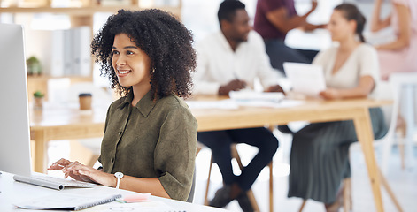 Image showing Computer, workspace and happy woman, web designer or creative employee typing online, internet or research. Worker, happy and african person on desktop pc in workplace, business or office webdesign