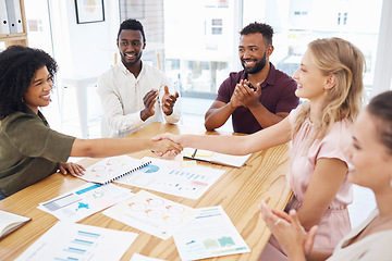 Image showing Handshake, clapping and business women in meeting celebration, success or thank you for financial profit or data. Teamwork, diversity and people shake hands in collaboration, thanks and project bonus