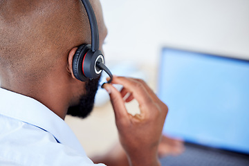 Image showing Consultant, back view of black man with headset and laptop at his desk for support. Telemarketing or customer service, online communication or networking and African male call center agent at work