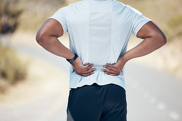 Image showing Back pain, fitness and man on the road, training and exercise with muscle tension, strain and emergency. Male person, guy and athlete with joint injury, outdoor and accident with a health problem