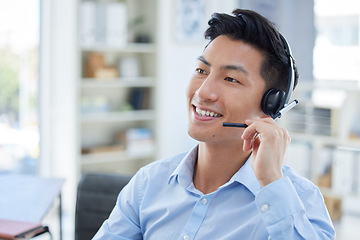 Image showing Smile, call center and asian man in office for customer support, advice and friendly service. Happy, telemarketing and male consultant online for help, support or crm, faq or contact us communication