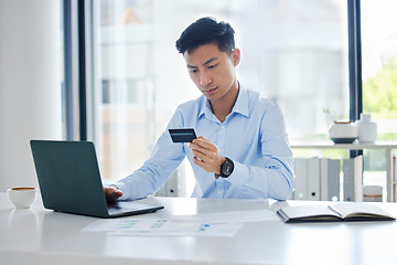 Image showing Asian business man, credit card and laptop for online shopping, typing info and payment on internet. Japanese businessman, banking and password for cybersecurity with sale, discount or fintech on web