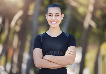 Image showing Runner, portrait or happy woman in park with arms crossed ready for a workout, exercise or fitness training. Face, sports girl or female athlete with smile, positive mindset or wellness in nature