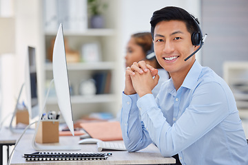 Image showing Business man, portrait and call center consultation in a office working on a computer. Smile, Asian male worker and web support advice of a contact us employee with professional communication at job