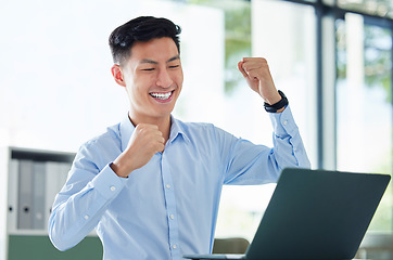 Image showing Winning, computer and business man in success, yes and cheers for bonus, investment and online profit or news. Winner, professional accountant or asian person with fist, celebrate sales and laptop