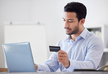 Image showing Trader, laptop or businessman with credit card in office for financial investment on digital fintech website. Finance, payment or Asian investor online shopping, banking or typing financial info