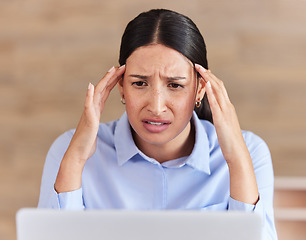 Image showing Business woman, headache and laptop in stress, depression or anxiety for fail or mistake at office. Face of frustrated female person or employee on computer in debt, bankruptcy or doubt at workplace