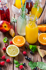 Image showing Preparing refreshing summer drinks and lemonade with fruits and berries