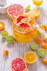 Image showing Preparing refreshing summer drinks and lemonade with fruits and 