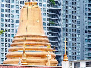 Image showing Golden pagoda and modern condo in Bangkok, Thailand