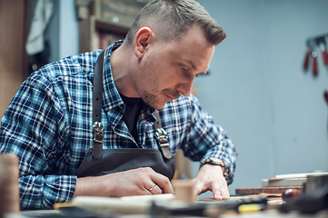 Image showing Concept of handmade craft production of leather goods.