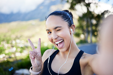 Image showing Happy woman, fitness and selfie with peace sign for profile picture in social media or online post in nature. Portrait of funny female person or runner with fun expression for photo or vlog outdoors