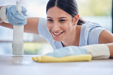 Image showing Happy woman, housekeeper and detergent for cleaning table, hygiene or bacteria and germ removal at home. Female person, cleaner or maid spraying or wiping furniture or surface for dust, dirt or stain