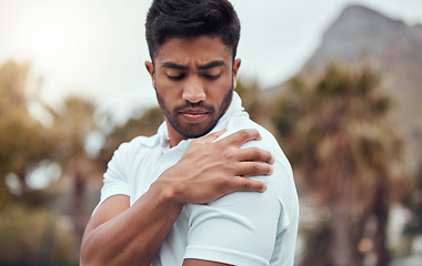 Image showing Shoulder pain, fitness and man outdoors with problem, arthritis or fibromyalgia during workout in a park. Arm, injury and male runner with sports accident, emergency or osteoporosis after cardio run