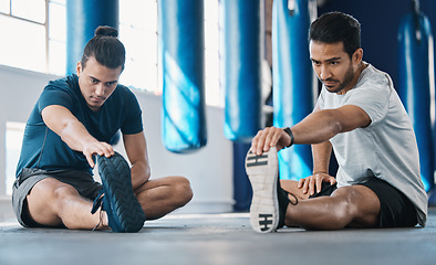 Image showing Men, gym and legs stretching of friends before training, fitness and workout in health club. Warmup, athlete and man ready to start sport exercise together on the floor with personal trainer class