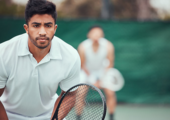 Image showing Male athlete, serious on tennis court for a competition with team and exercise in india. Man, racket and together for game at sports club in the outdoor for fitness with challenge to play in closeup.