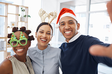 Image showing Selfie, christmas and a friends at an office party together at an end of year function for celebration. Portrait, smile and festive with a happy group of colleagues posing for a photograph at work