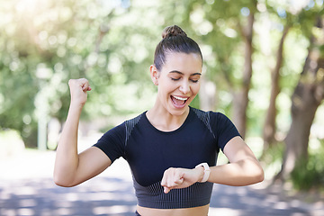 Image showing Success happy girl or runner with smartwatch in park for heart rate to monitor training or exercise progress. Excited, yes or healthy sports athlete with timer celebrates running workout or fitness