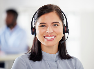 Image showing Customer service, portrait of woman with headset and happy at her desk in a modern workplace office. Telemarketing or consultant, support or crm and female call center agent happy at workstation