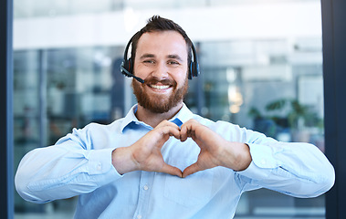 Image showing Callcenter agent, man with smile and heart hands in portrait, love customer service job and feedback. Hand gesture, care emoji and male consultant is happy with job at contact center and tech support