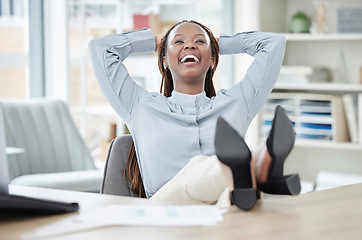 Image showing Business, relax and black woman with feet on a desk, smile or achievement with confidence, career or professional. Female person, employee or consultant with completed task, rest and finished project