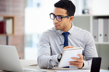 Image showing Writing, computer and business man, accountant or employee of finance, budget or analysis in career notebook. Journal, bookkeeping notes and person reading financial report on laptop for job priority