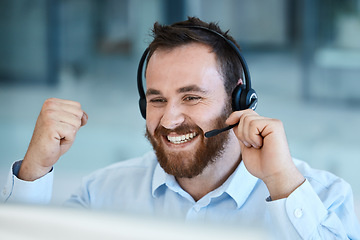 Image showing Happy man, call center and fist in celebration for success, promotion or winning bonus at the office. Excited businessman, consultant or agent in joy for win, victory or customer service at workplace