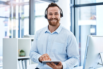 Image showing Portrait, call center and man with a tablet, telemarketing and customer service with headphones, connection and typing. Face, male person or agent with tech support, technology and headset for advice