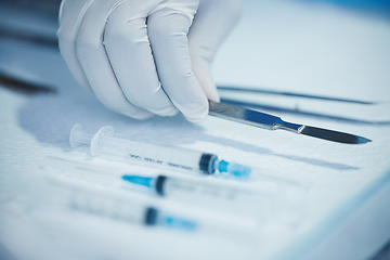 Image showing Closeup of hand, doctor and medical tools, scalpel and needle syringe for surgical procedure in healthcare. Medicine, health insurance and operation, surgeon person in hospital with clean instruments