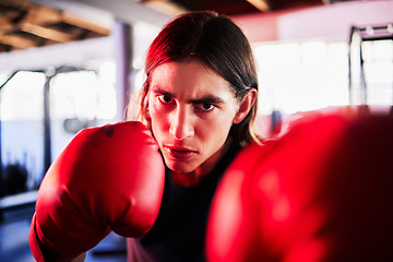 Image showing Portrait, man and boxer in gym for workout, exercise or training for fight. Boxing sports, face and serious fitness athlete punch for mma challenge, competition or exercising for martial arts power.