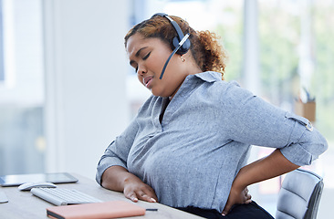 Image showing Call center, back pain and woman consulting for customer service while suffering arthritis or inflammation in office. Spine, backache and female consultant with posture issue while working for crm