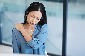 Image showing Call center, tired agent or woman with shoulder pain and headset in telemarketing, sales or crm office. Frustrated customer care consultant person back ache problem, burnout and posture or stress