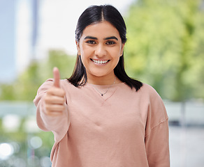 Image showing Face, thumbs up and smile portrait of a woman in a house with sign for support, thank you or yes. Happy Indian female model person show hand or like emoji for success, trust and goals or good job