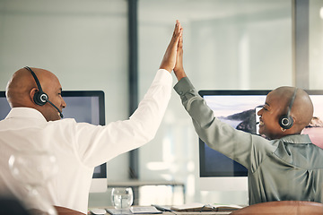 Image showing Customer service, team and high five for success with headset at computer for sales or telemarketing. Back of black man and woman celebrate bonus, crm solution or target achievement in a call center