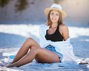 Image showing Woman relax on beach, portrait and smile with travel, summer vacation with tourism and adventure. Female person is happy, tropical holiday in Mexico and journey to seaside with sunbathing and rest