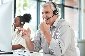 Image showing Call center, customer support and senior man on computer for online help, advice and telemarketing. Communication, office and mature male worker point to screen for contact, crm service or consulting