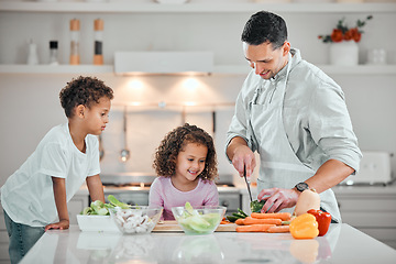 Image showing Cooking, help and salad with family in kitchen for health, nutrition and food. Diet, support and dinner with man and children cutting vegetables at home for wellness, meal prep and learning