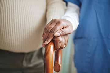 Image showing Cane, senior patient and nurse holding hands for support, healthcare and kindness at nursing home. Elderly person and caregiver together for homecare, rehabilitation or help for health in retirement