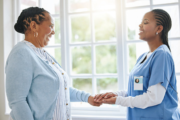 Image showing Senior patient, woman nurse and holding hands for support, healthcare and kindness at retirement home. Black person and caregiver together for trust, elderly care and help for health and wellness