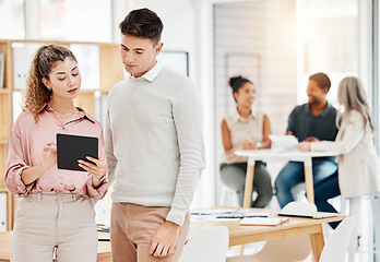 Image showing Tablet, teamwork and business people in coworking office, workspace or startup company with website design ideas. Review, check and woman with partner planning on digital technology for webdesign