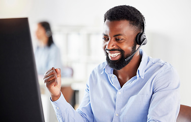 Image showing African man, call center and fist celebration with smile, win or success with profit, bonus or promotion. Young black consultant, winner and goals in telemarketing office on fintech, stock or trading