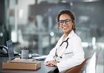 Image showing Doctor, happy woman in healthcare and portrait with medical professional, confident with stethoscope and laptop. Female person in medicine, desk and health insurance with cardiologist at hospital