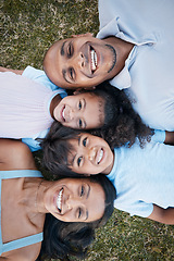 Image showing Family, portrait and lying on grass in garden with mother, father and kids together with love. Face, top view and dad with mom and children with parent support and care on a lawn with happy smile