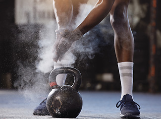 Image showing Powder, hands and kettlebell exercise with a man at gym for fitness, training and strong muscle. Athlete or bodybuilder person start weights workout for power and performance with chalk at a club