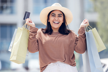 Image showing Woman, smile with credit card and shopping bag at mall with luxury, retail and excited for shop discount. Happy female customer at outdoor market, fashion and buyer choice banking budget and sale