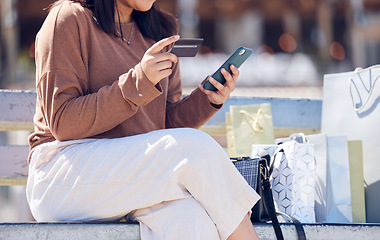 Image showing Closeup, smartphone and woman with a credit card, bags and online shopping with payment, ecommerce and retail. Female person, customer outdoor or shopper with boutique items, cellphone and purchase