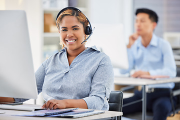 Image showing Business woman, portrait and call center consultation in a office working on a computer. Smile, African female worker and web support of a contact us employee with professional telemarketing job