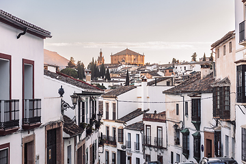 Image showing Views of the medieval village of Ronda with white Andalusian houses and the gothic style church of Santuario de Maria Auxiliadora. Malaga, Spain.