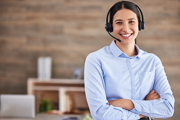 Image showing Call center, portrait and woman with arms crossed and headset for calls, working in communication and crm office. Agent, smile and happy customer service worker to help, support and consulting advice