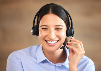 Image showing Happy woman, face and headset at callcenter, contact us and customer service agent with smile. CRM, phone call and tech support with telecom, female consultant smile with help desk and communication